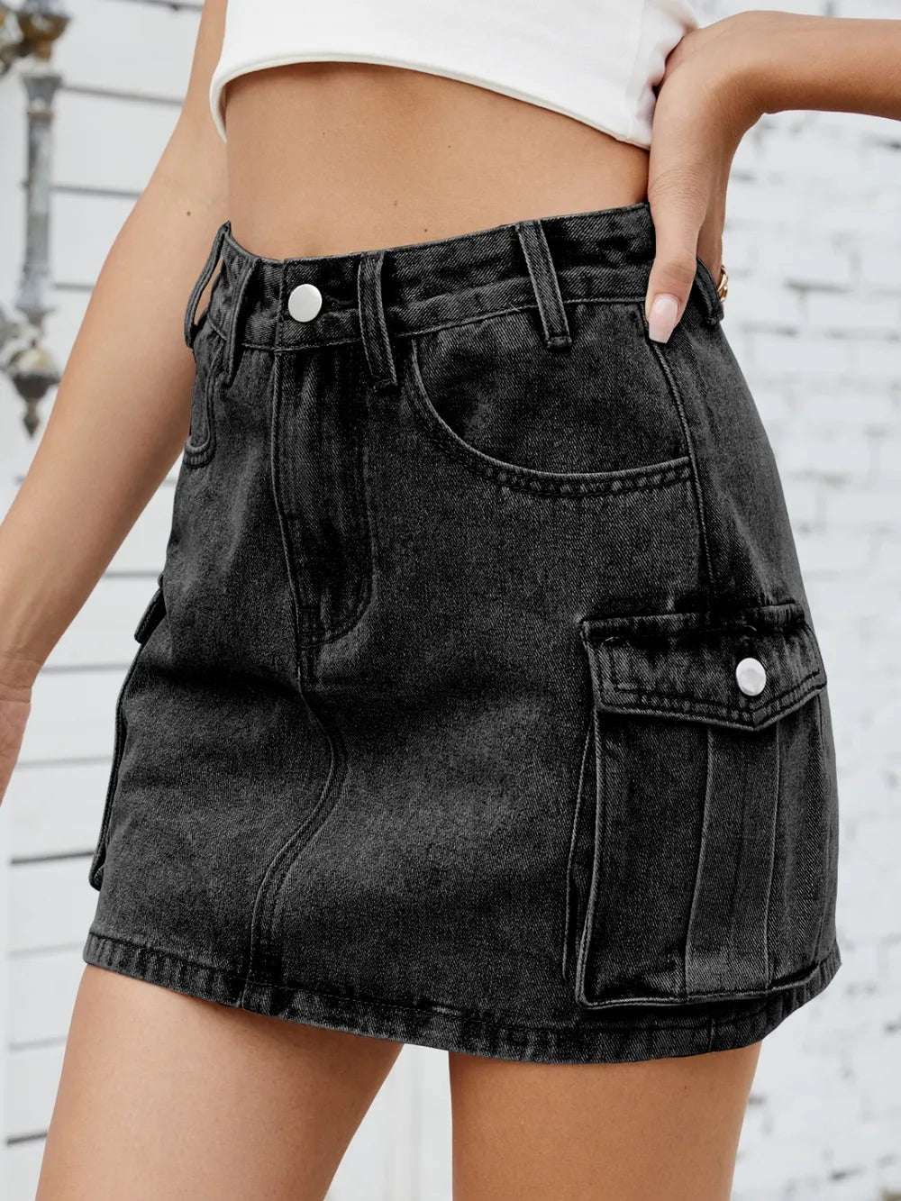 Daylight photo of cargo denim skirt styled for city travel

