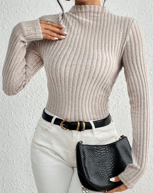 Back view of elegant high-neck jumpsuit in soft knit

