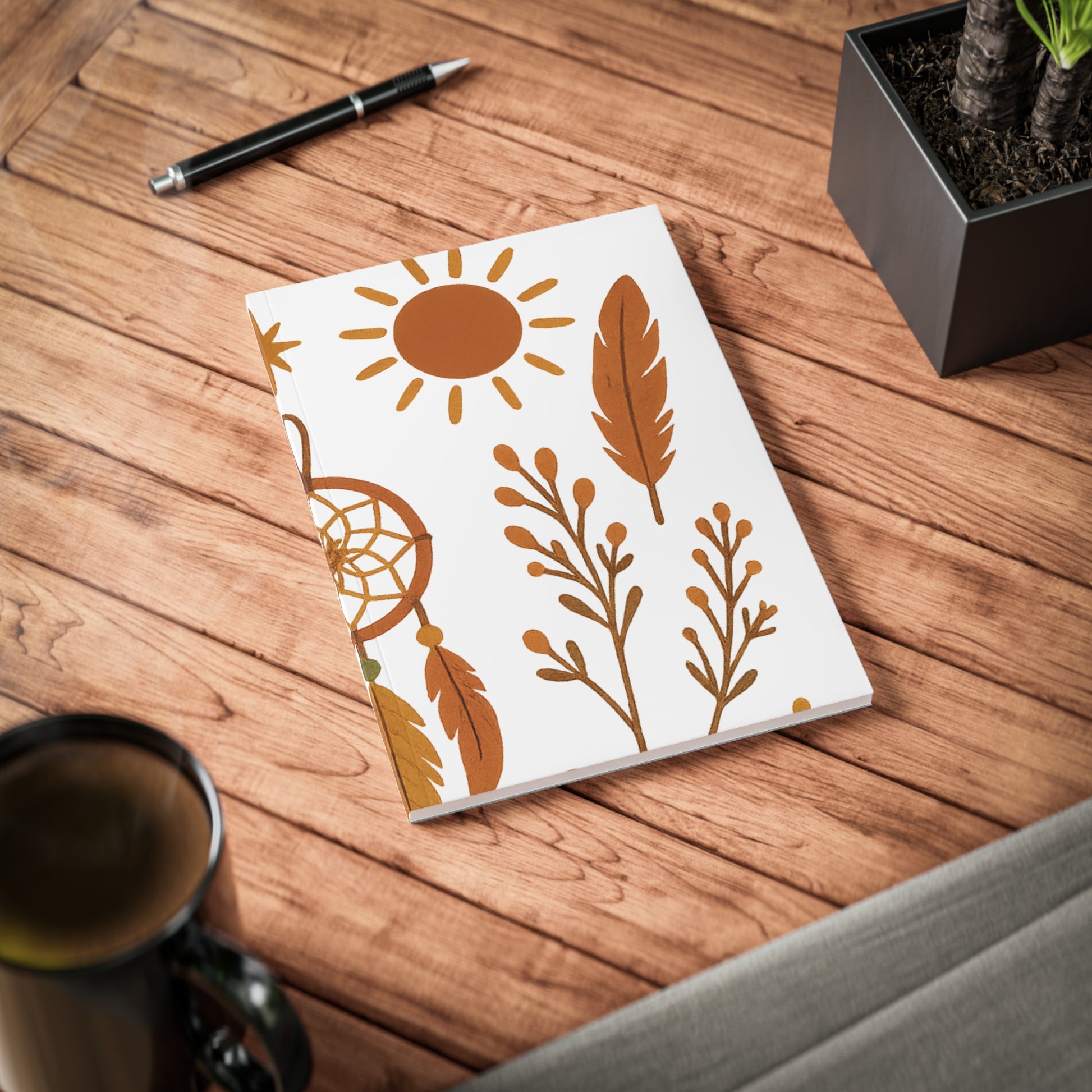 Boho dreamcatcher design in earthy tones on softcover A5 notebook for everyday creativity.

