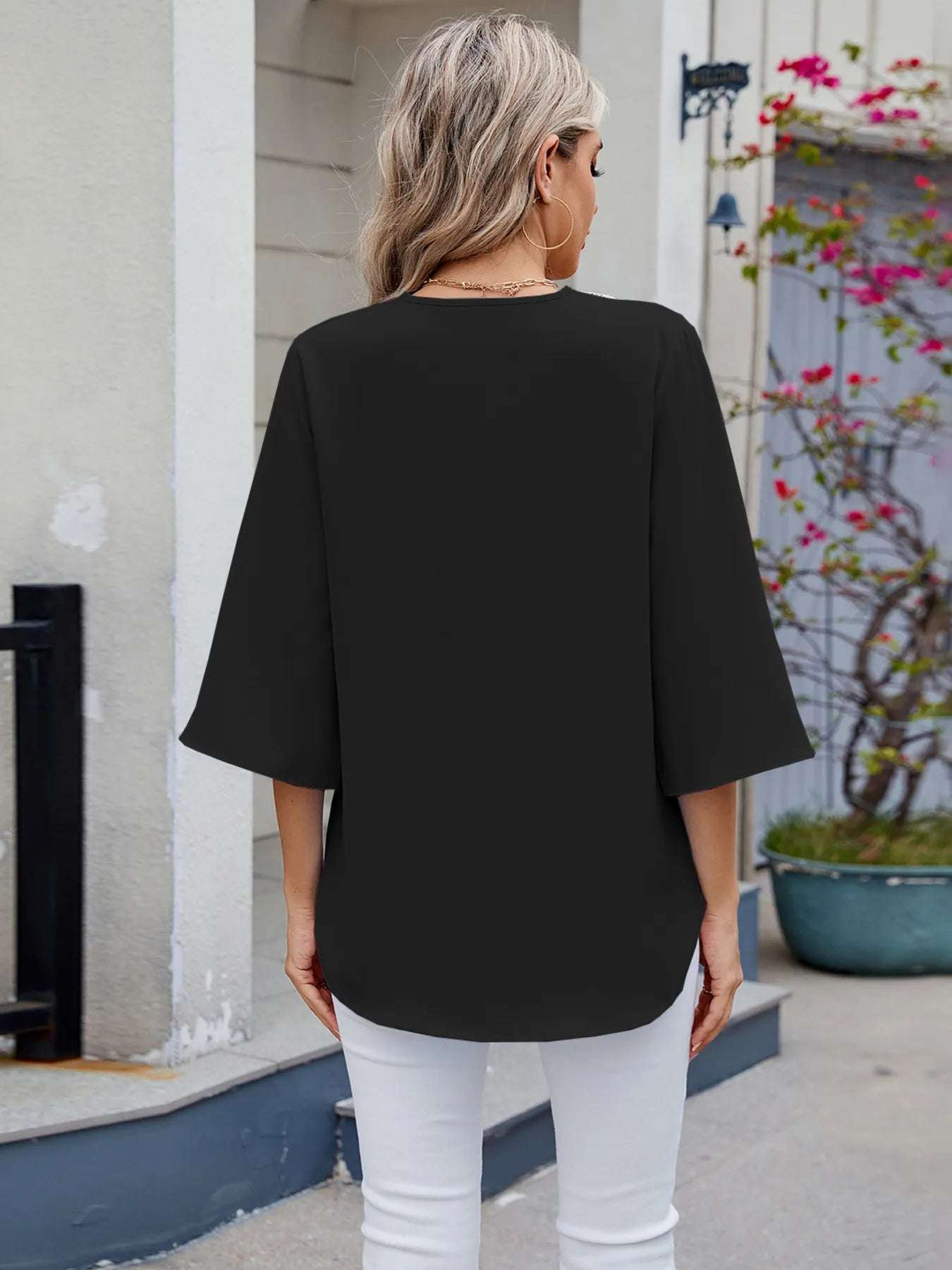 Feminine lace V-neck blouse ideal for layering in spring

