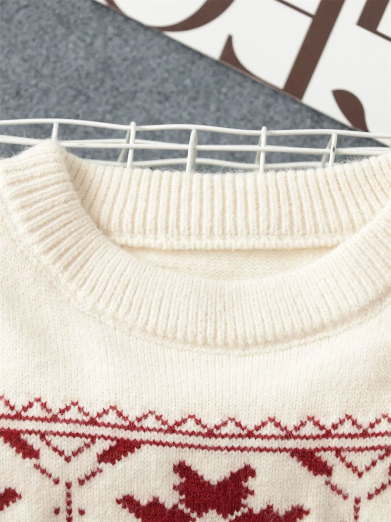 Christmas snowflake sweater – close-up knit texture and crisp snowflake pattern details