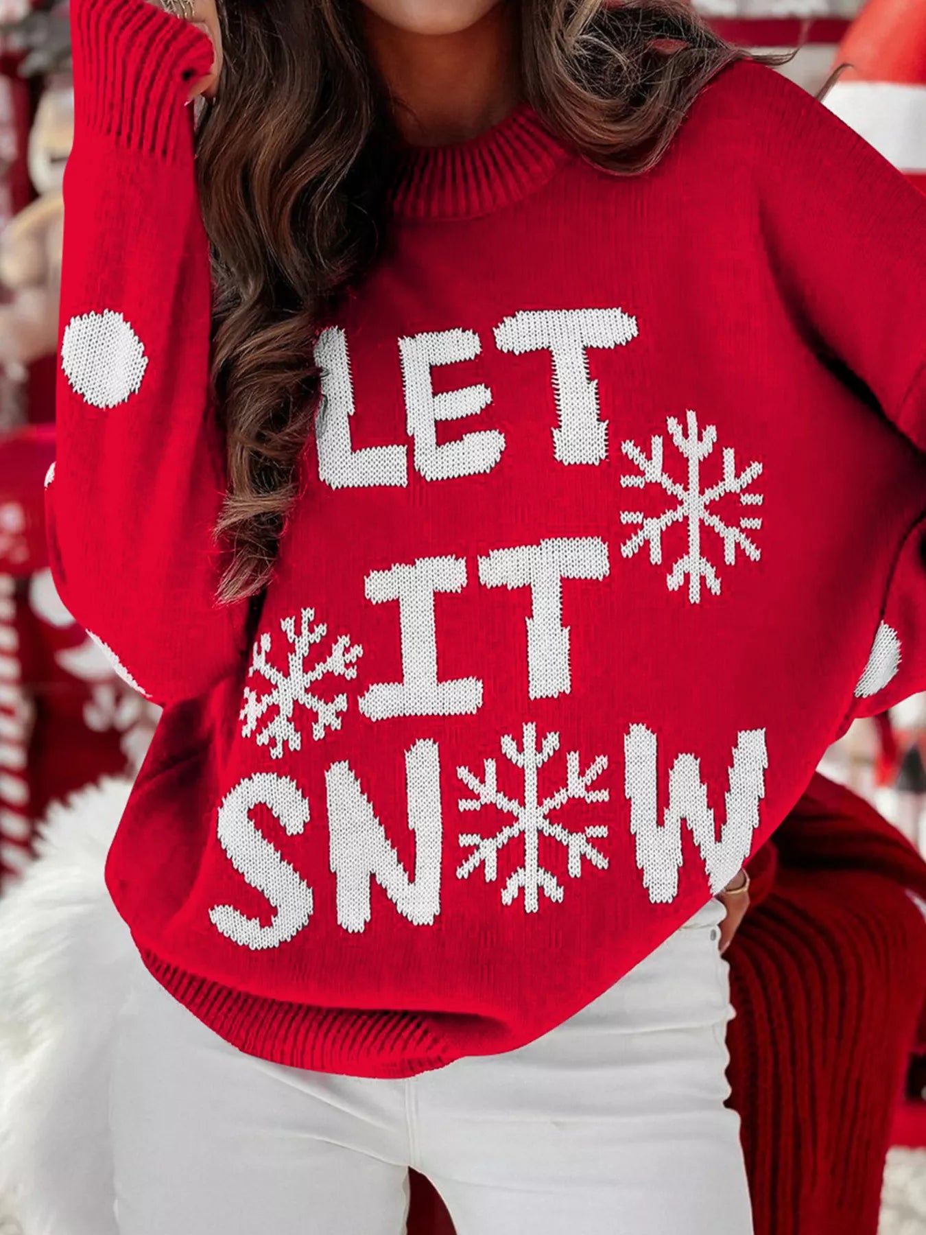 Classic Let It Snow Christmas sweater styled with jeans and boots