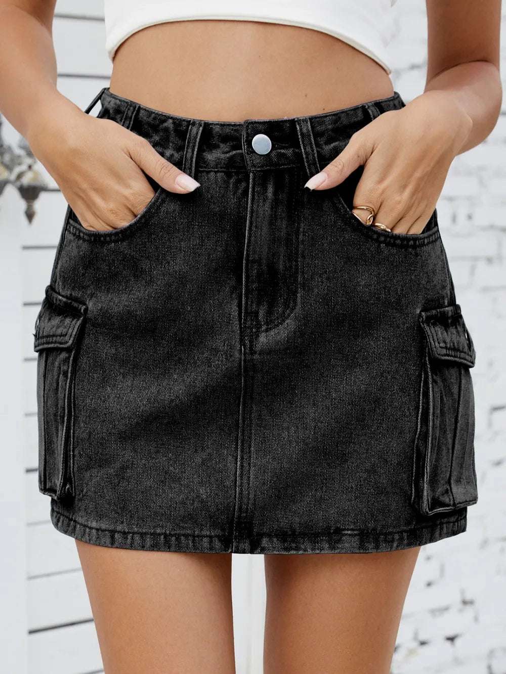 Cargo denim skirt paired with graphic tee and platform shoes

