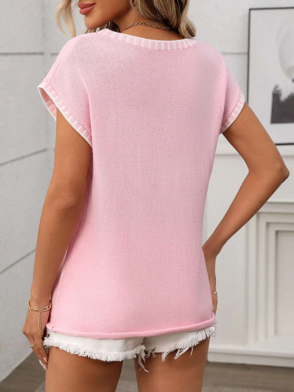 Contrast knit top styled under a blazer for workwear look

