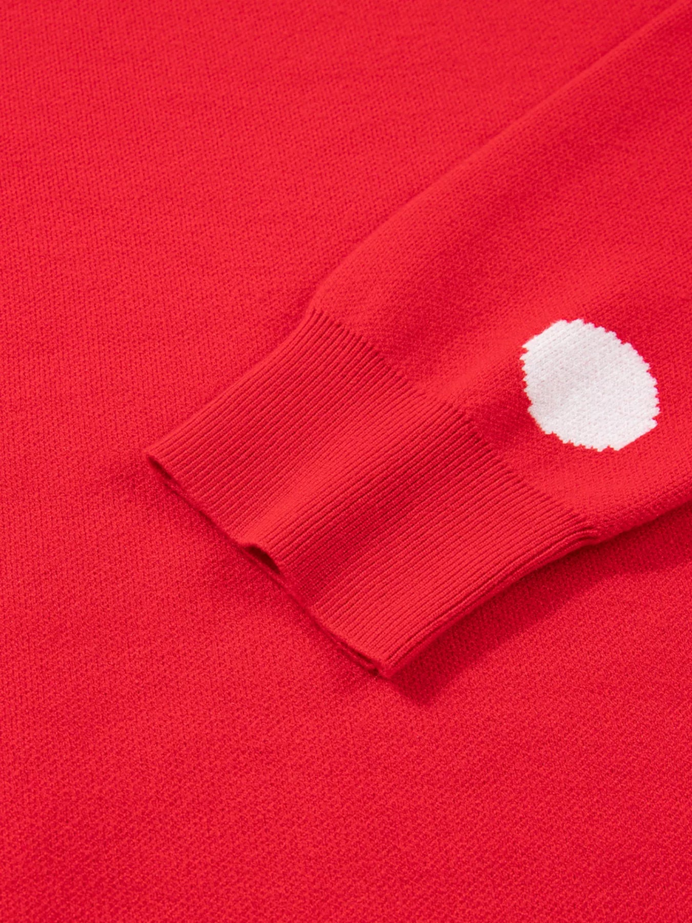 Close-up logo on Let It Snow Christmas sweater – clean lettering