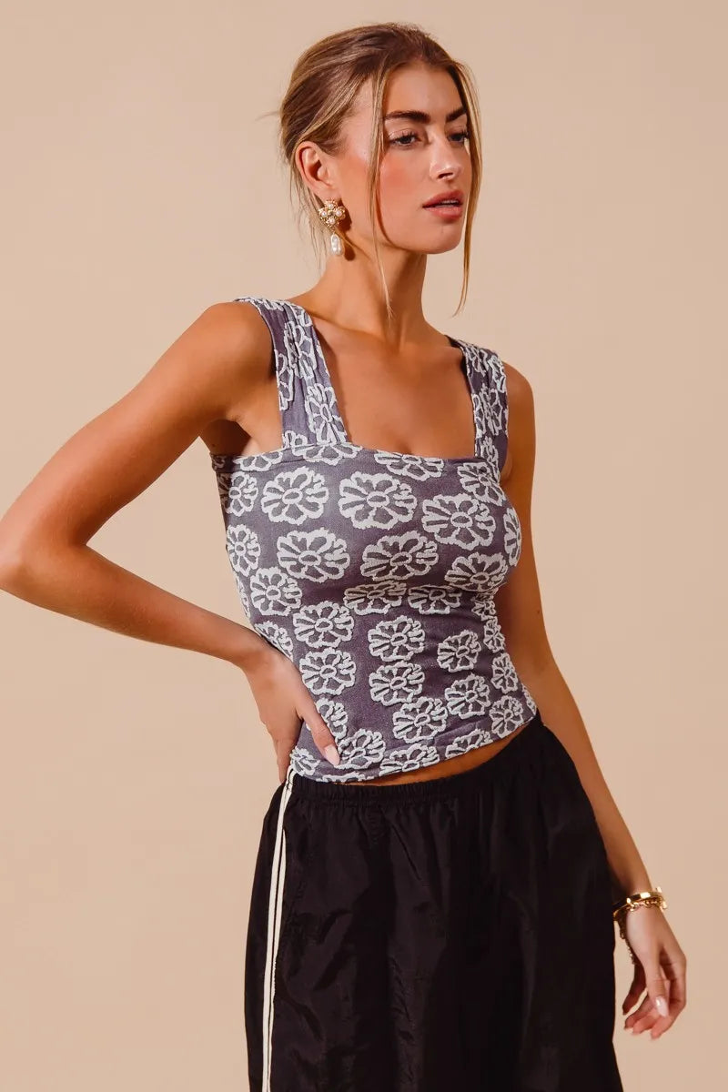 “Close-up of Two Tone Floral Seamless Tank Top’s neutral floral print and smocked sides”

