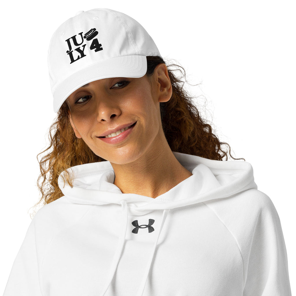 Close-up of a woman smiling in a red Unisex Under Armour® Dad Hat, man beside her in a white Unisex Under Armour® Dad Hat

