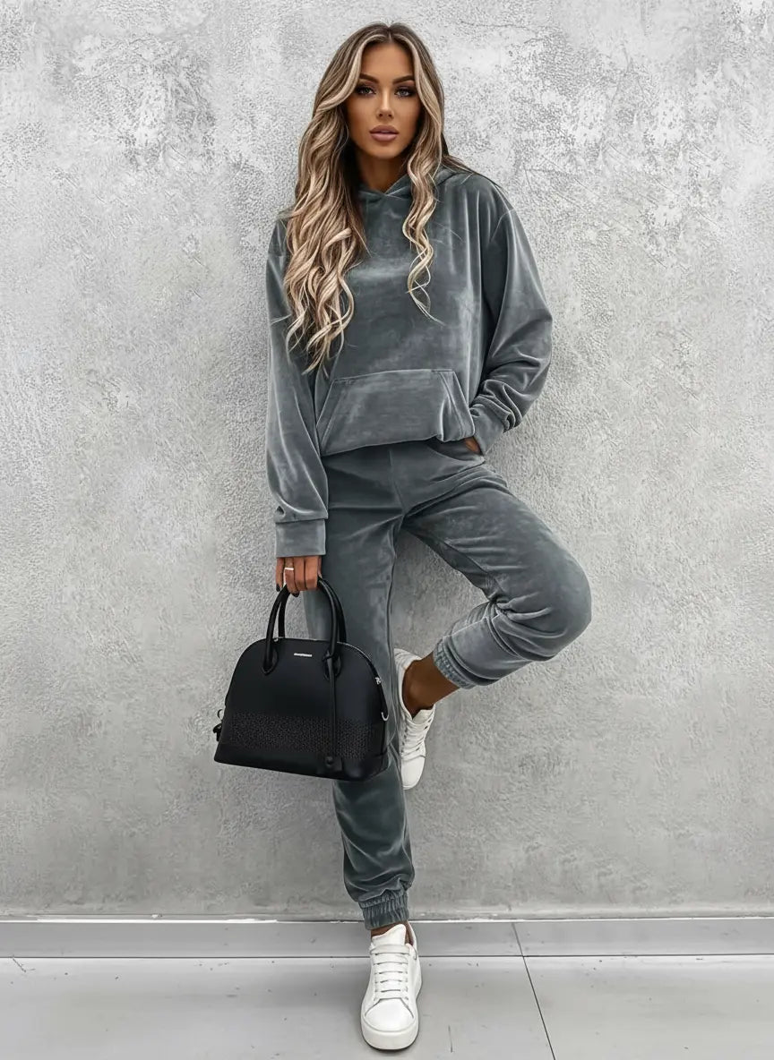 Close-up of kangaroo pocket on women's kangaroo pocket hoodie pants set, showcasing secure storage for keys during brisk walks. 