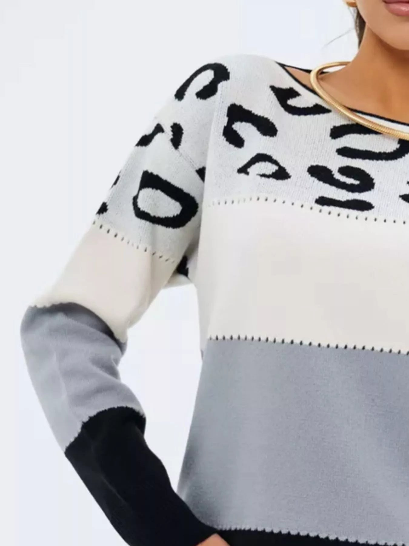 Close-up of leopard pattern and solid sleeve seam