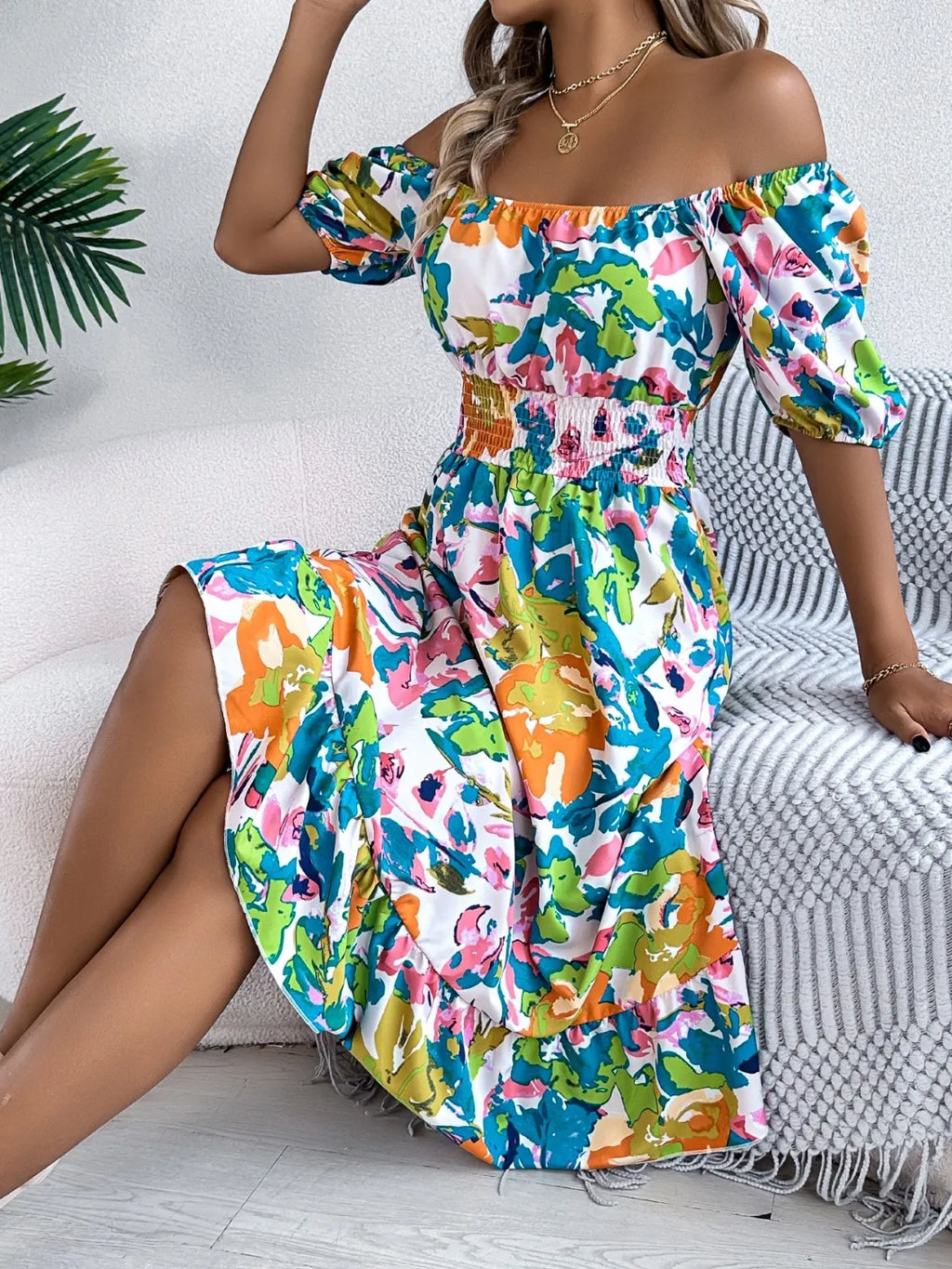 Close-up of ruffled hem and delicate floral smocking

