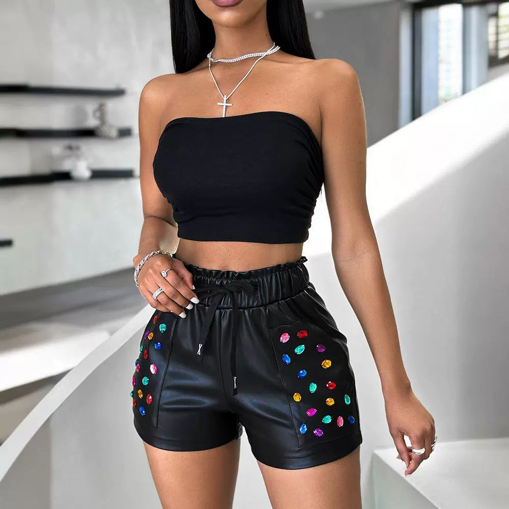 Close-up rhinestone detail on PU shorts – gleam that lasts