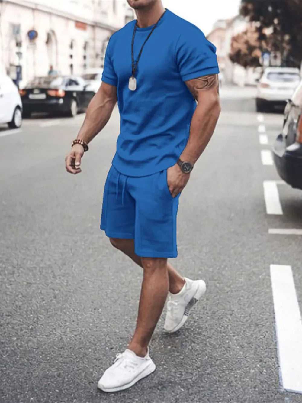 Detail of round neck short sleeve top from men’s plus size set

