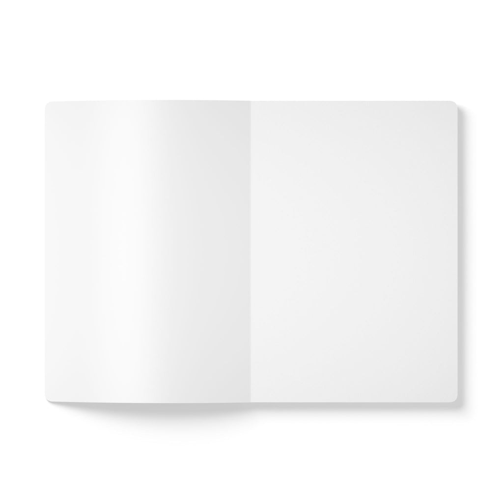 Compact softcover journal lying on artist’s desk

