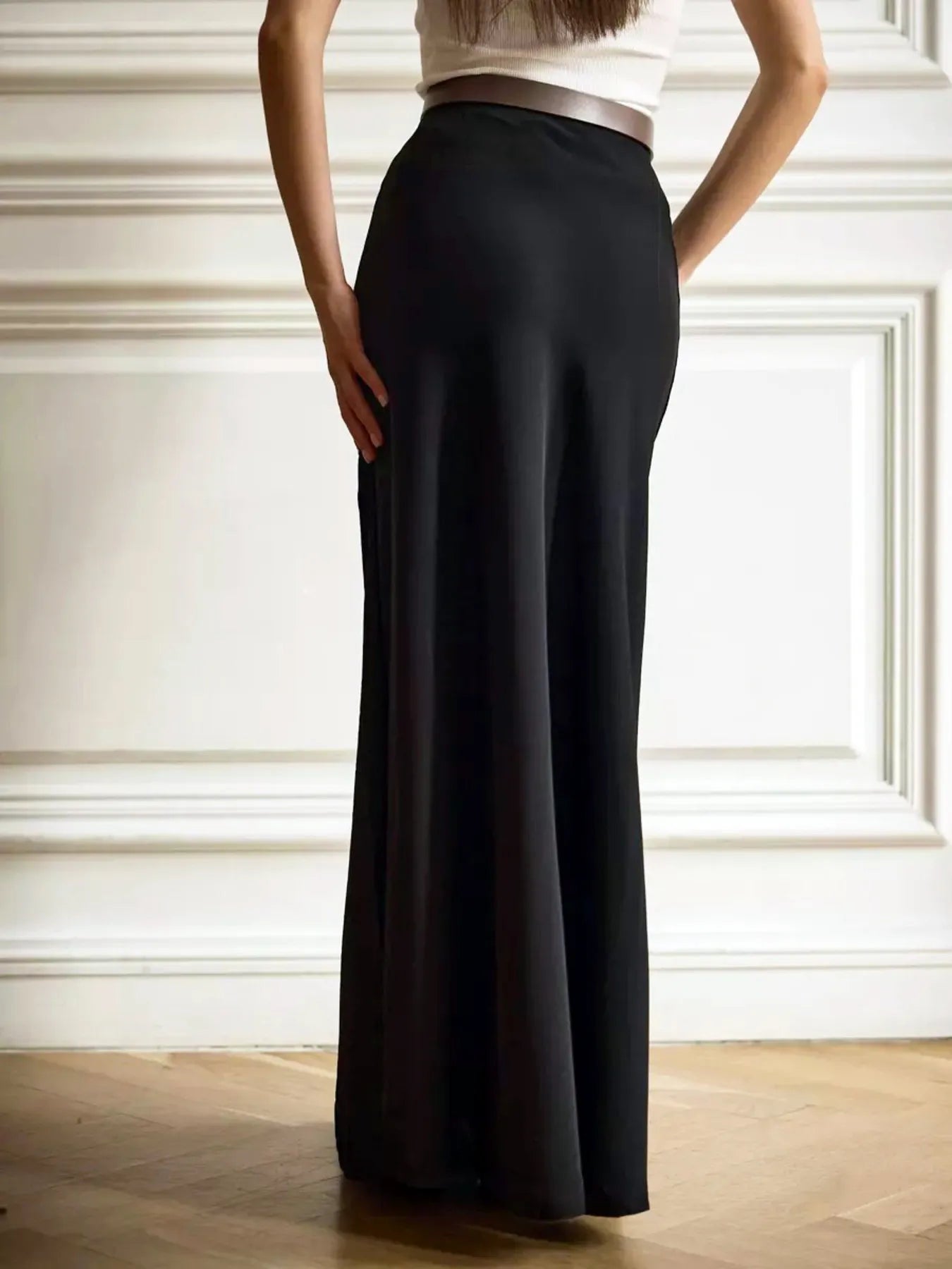 Detail shot of 95% polyester, 5% spandex fabric stretch and texture on the skirt.

