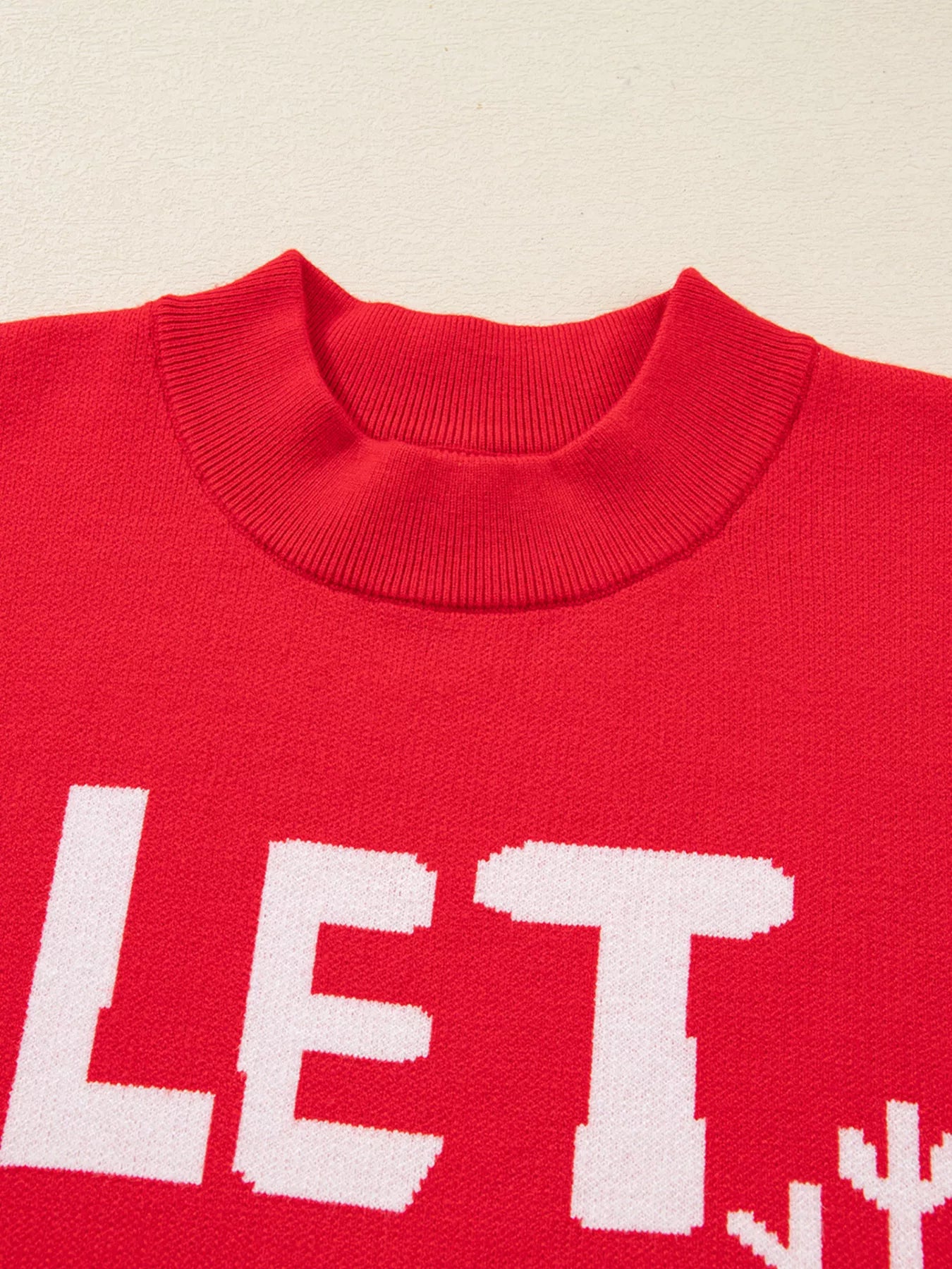 Detail shot of Let It Snow Christmas sweater knit texture