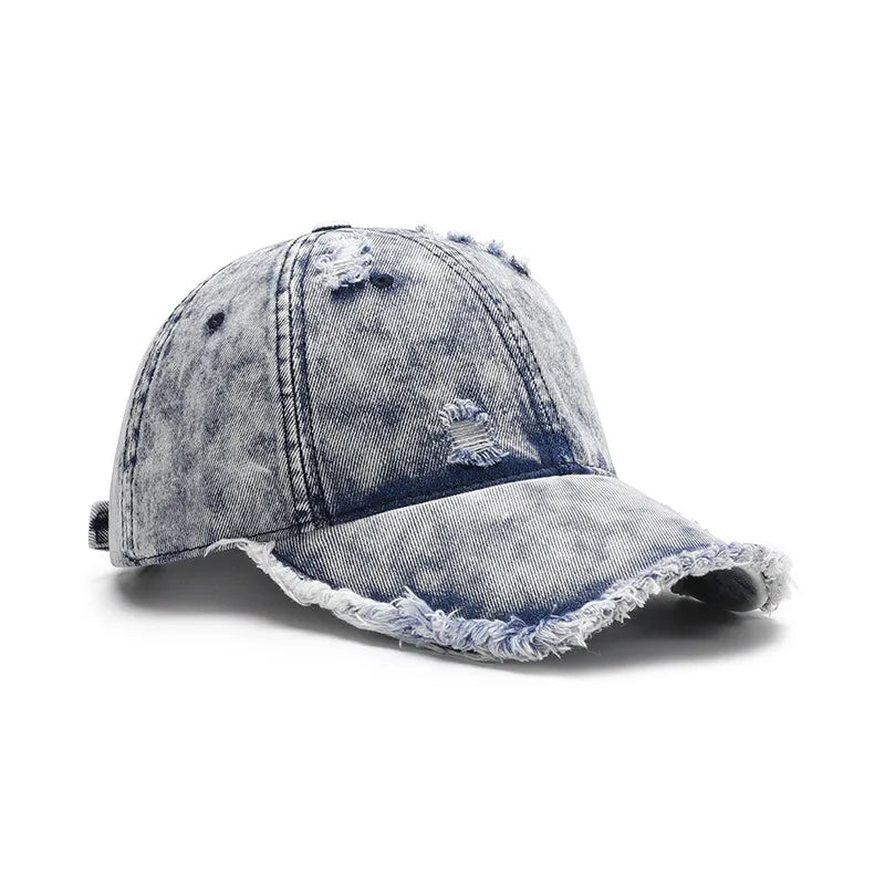 Detailed look at the embroidered logo on the Distressed Cotton Baseball Cap

