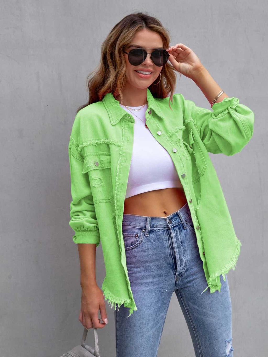 Distressed denim jacket – back view showing fringe swing and drop shoulder