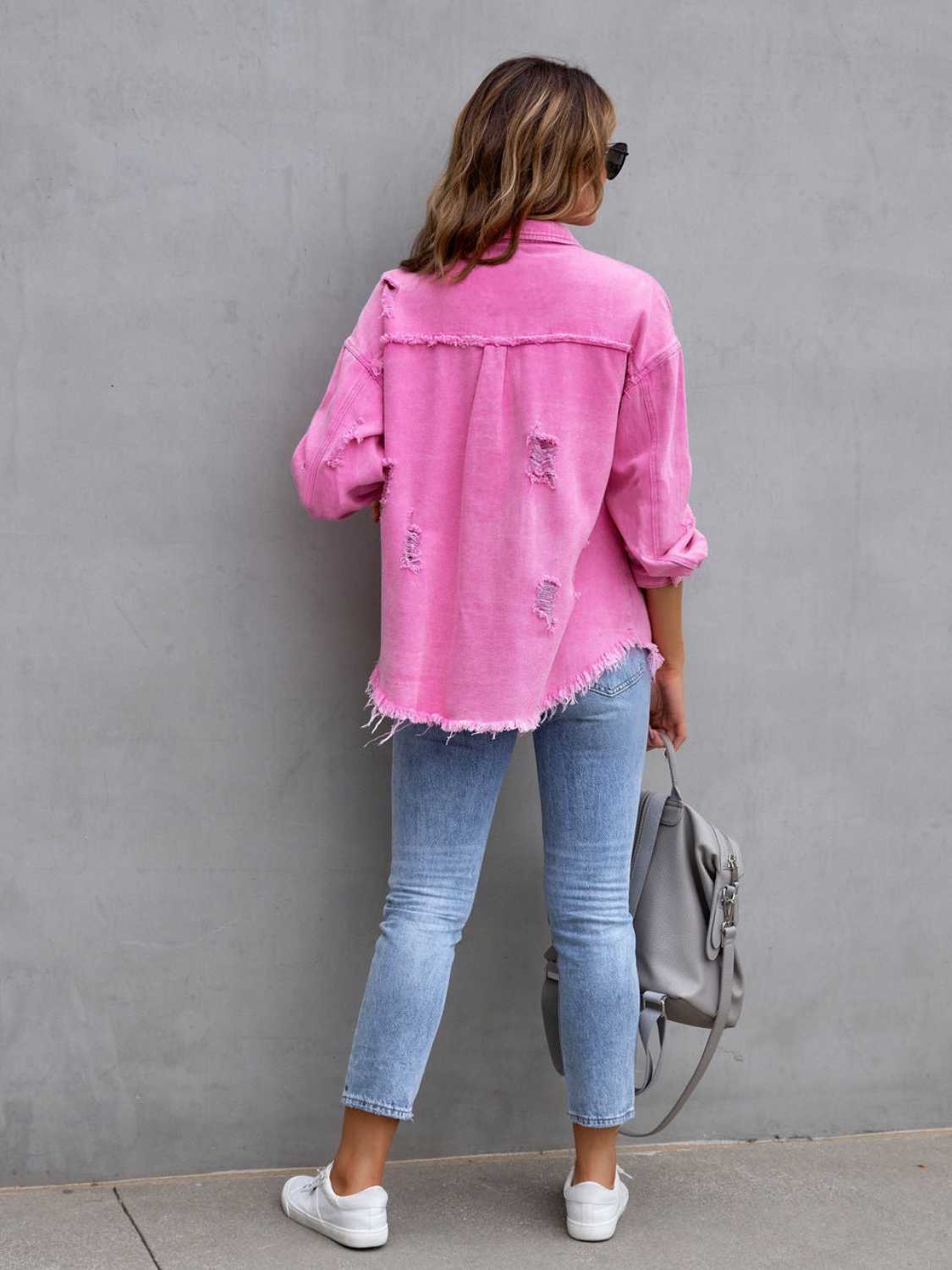 Distressed denim jacket close-up – fringe detail and washed finish