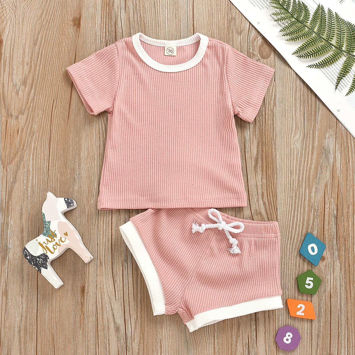 Easy-care instructions shown for our durable infant two-piece set outfit.