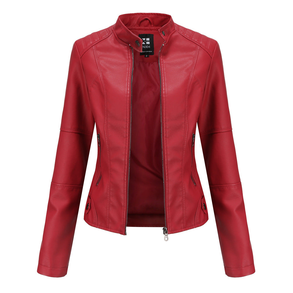 Elegant PU leather jacket women’s outfit paired with boots and skinny jeans

