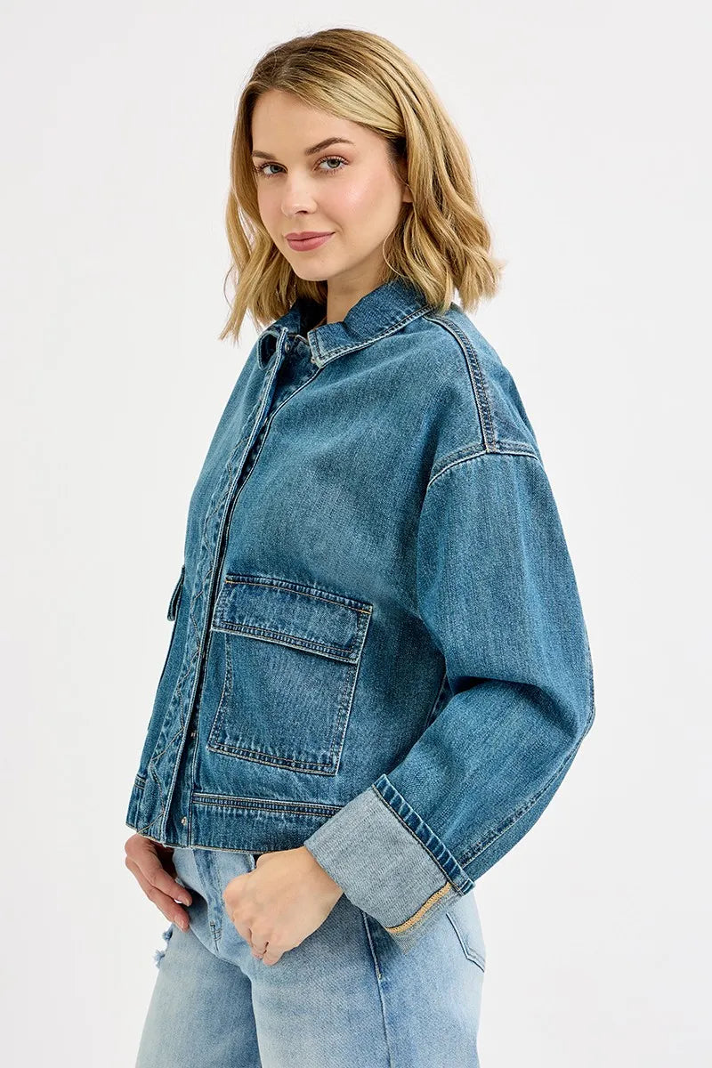 Evening look with denim jacket paired with sleek trousers

