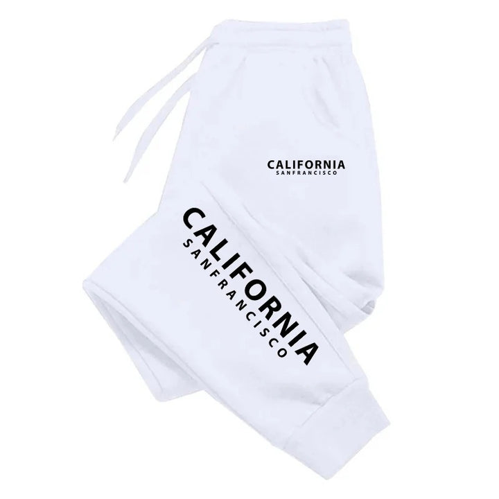 White California print sweatpants with black lettering, matching drawstrings and ankle cuffs folded against a white backdrop.