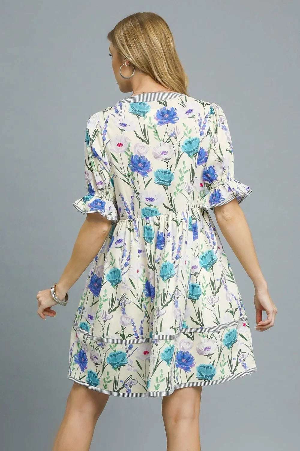 Fabric texture of Umgee BabyDoll Floral Striped Hem Mini Dress showing 100% cotton weave

