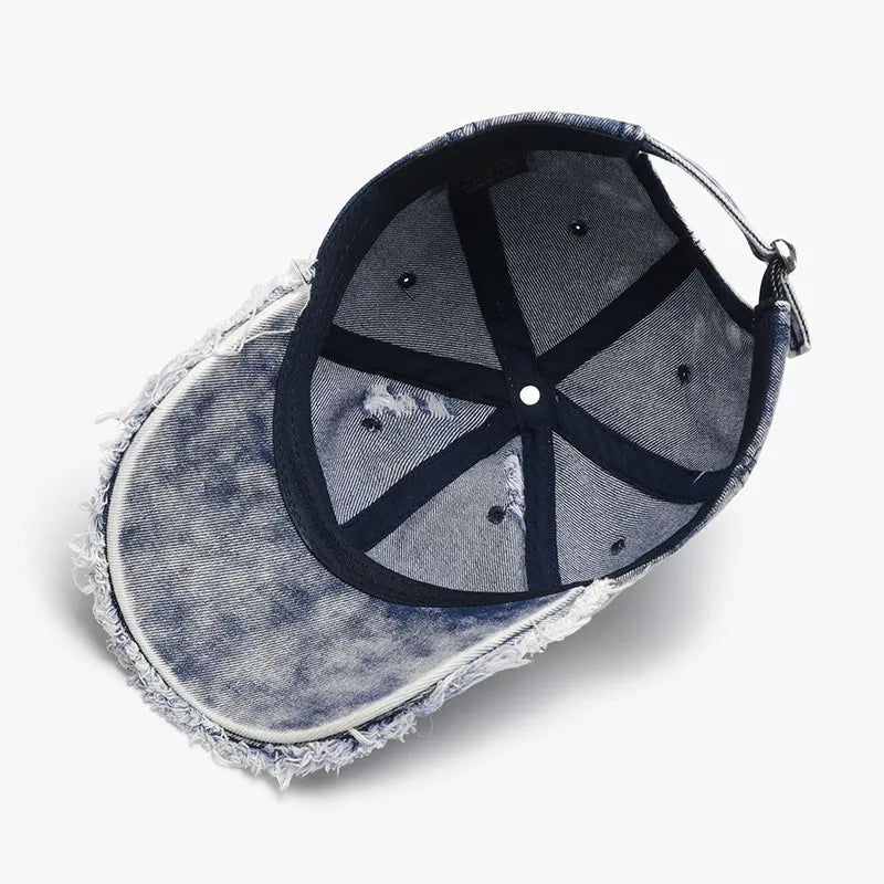 Flat lay featuring Distressed Cotton Baseball Cap alongside everyday essentials

