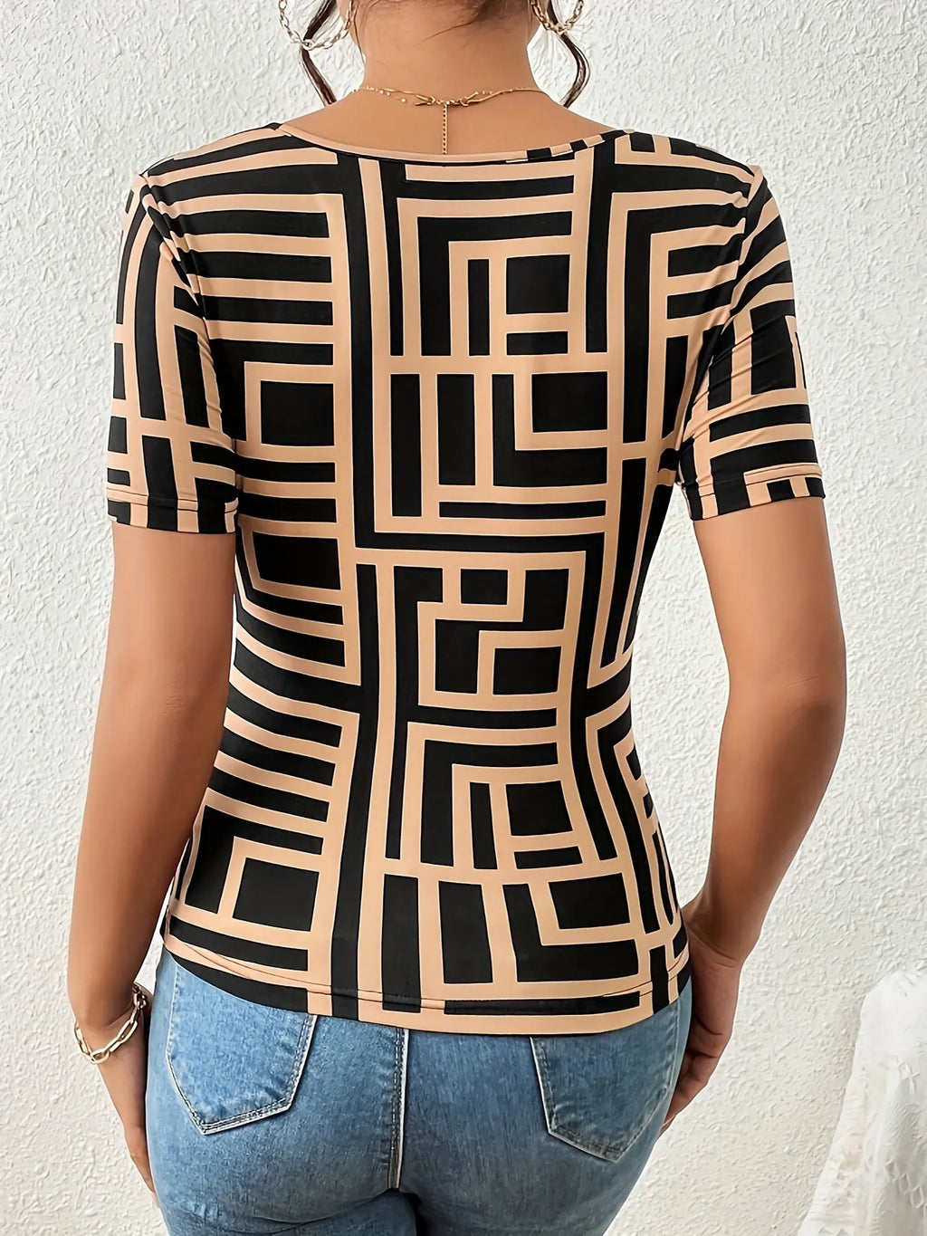 Flat lay of Geometric Print Short Sleeve T-Shirt withstyled accessories

