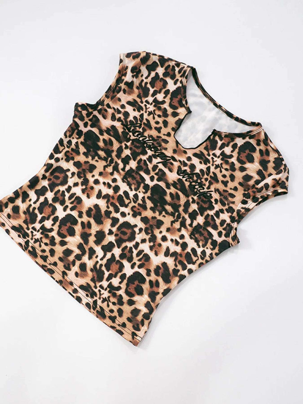Detail shot of top's notched neckline from leopard print women's set

