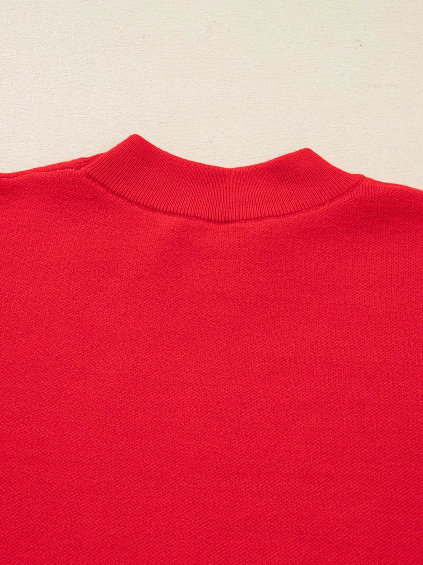 Gift-ready Let It Snow Christmas sweater with ribbon and tag