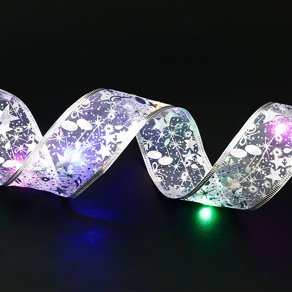 Gift wrapping idea: fairy lights ribbon around kraft paper parcel

