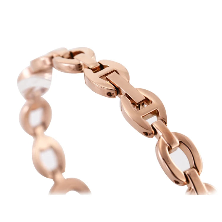 A close-up of a rose gold chain bracelet with polished oval links and a matching clasp, shown against a plain white background.