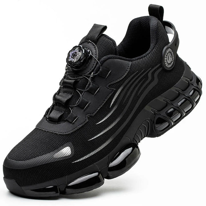 Black athletic steel toe shoe with silver accents, mesh upper and black segmented sole.