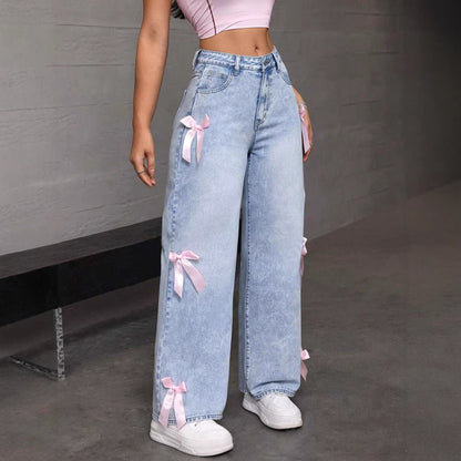 High-angle view of wide-leg bowknot collage jeans emphasizing comfort and flow