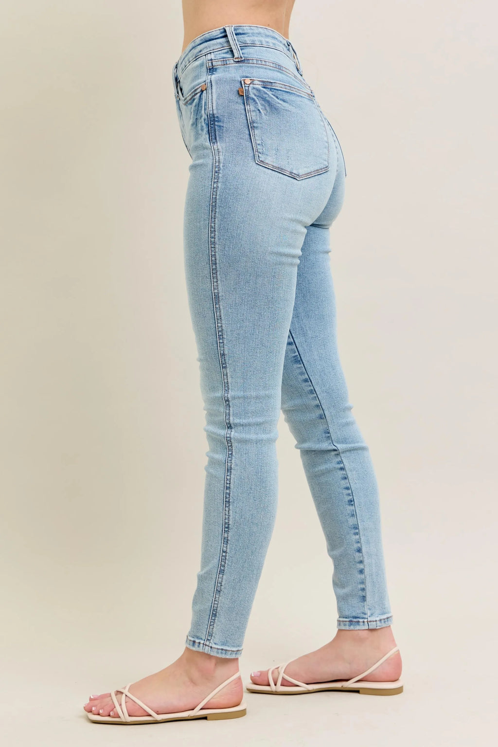High waist light blue jeans on mannequin display.







