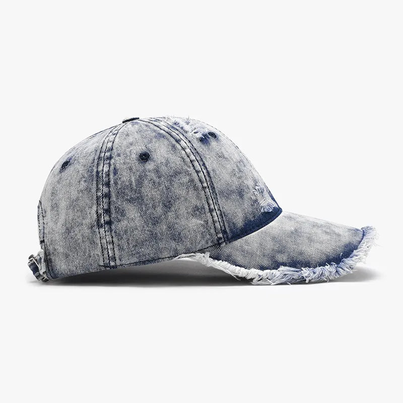 Lifestyle shot: Distressed Cotton Baseball Cap styled with sunglasses and denim jacket

