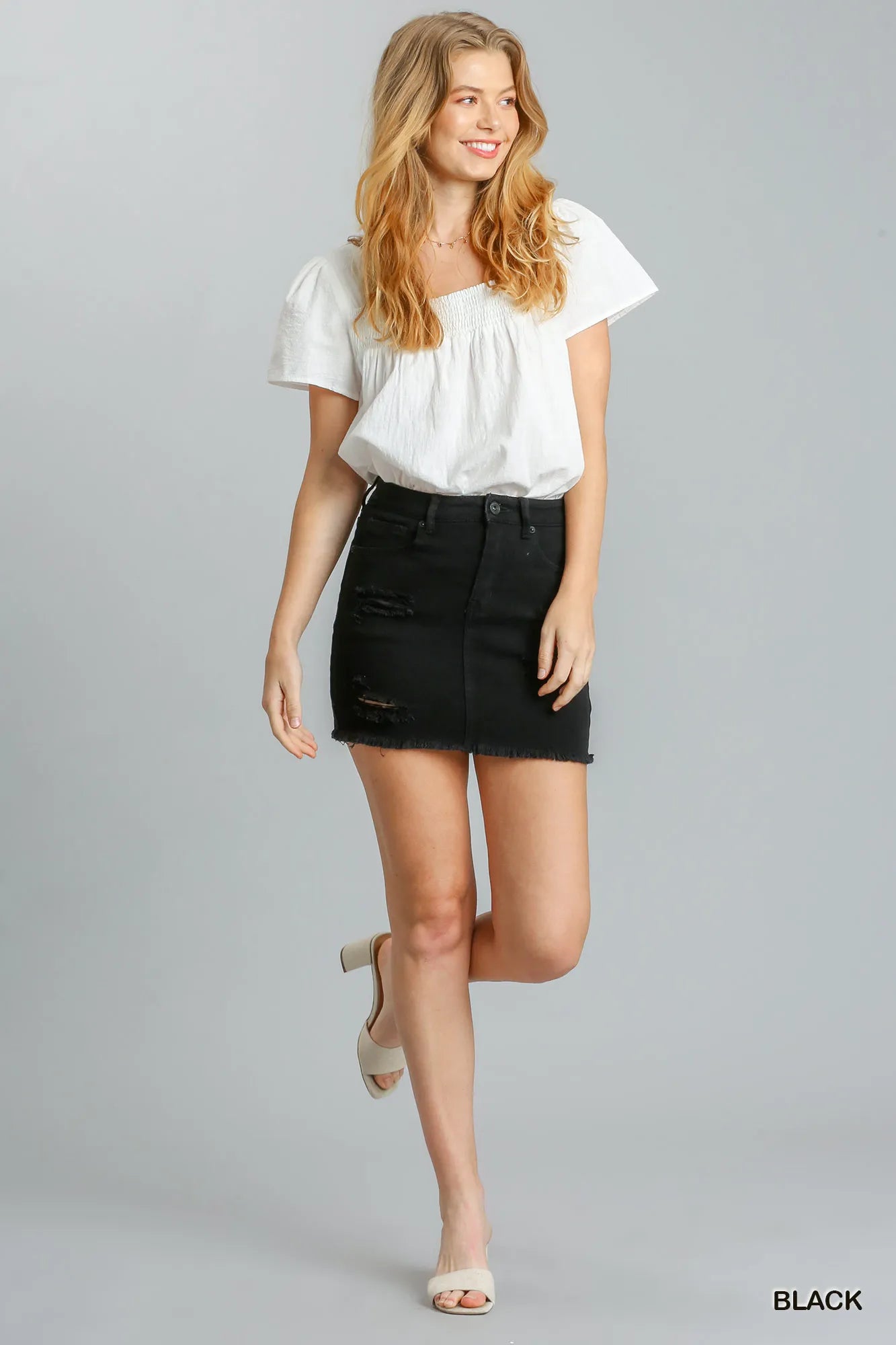 Lifestyle – skirt styled with tee & sneakers for streetwear vibe



