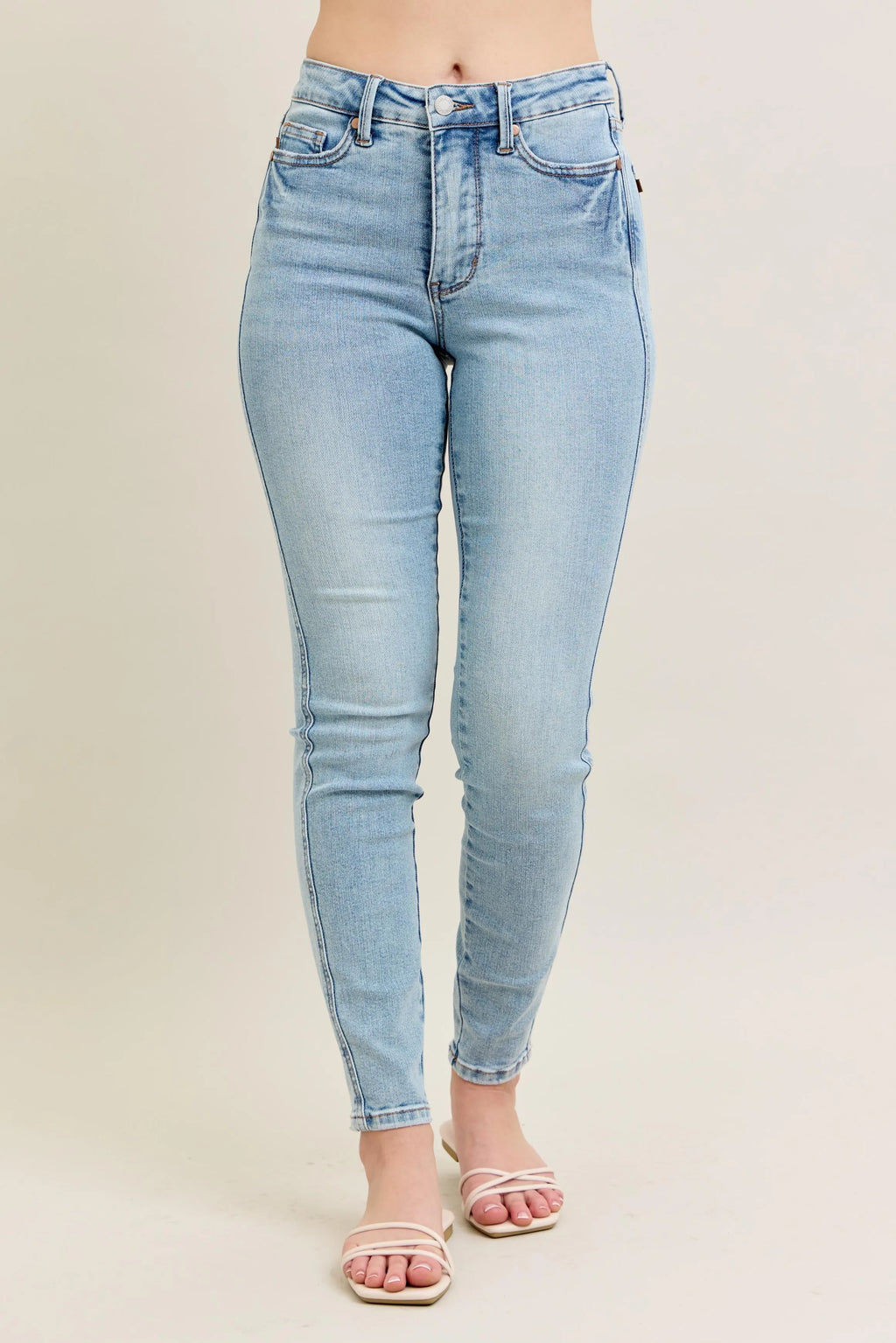 Light blue Sexy Ripped Denim Jacket for Women laid flat to showcase raw-edge hem and pockets.

