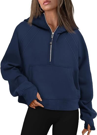 Stylish beige women’s zip hoodie worn with scarf and boots in outdoor scene

