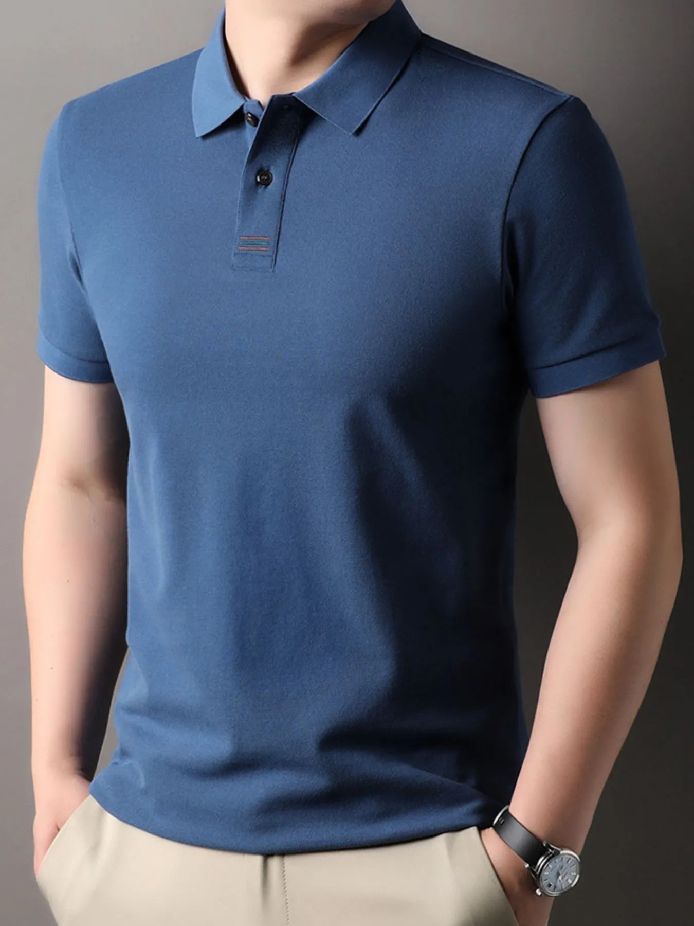 Men’s Plus Size Polo – Model in motion showcasing slight stretch and breathability