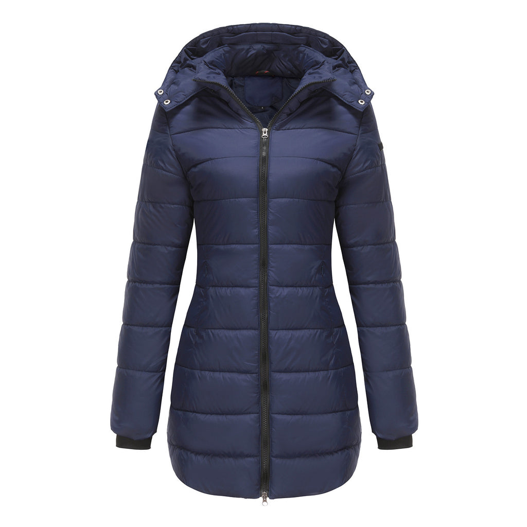 Model in black waterproof cotton-padded jacket on illuminated rooftop at dusk

