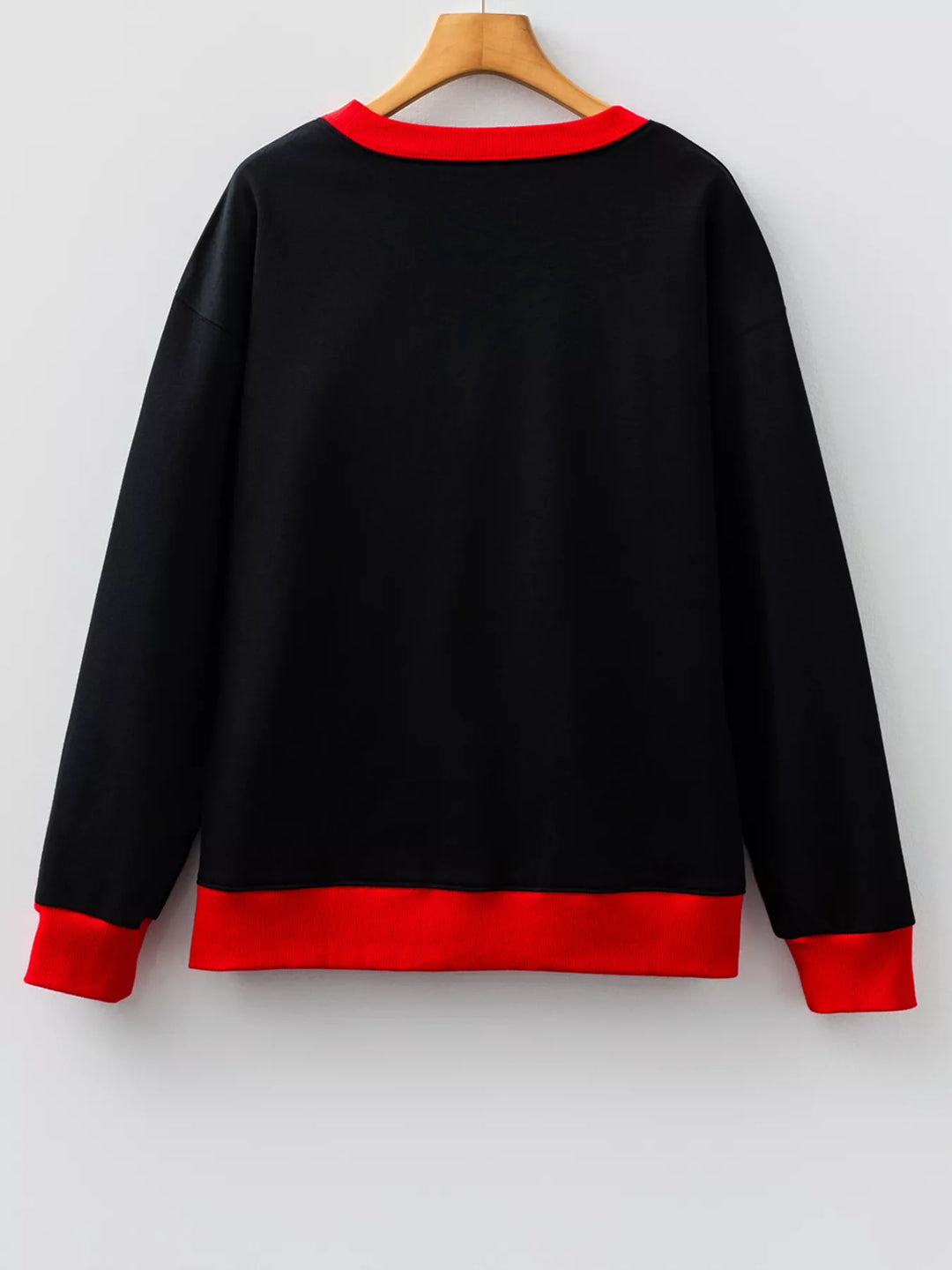 Model layering Game Day Sweatshirt over jeans for casual varsity look