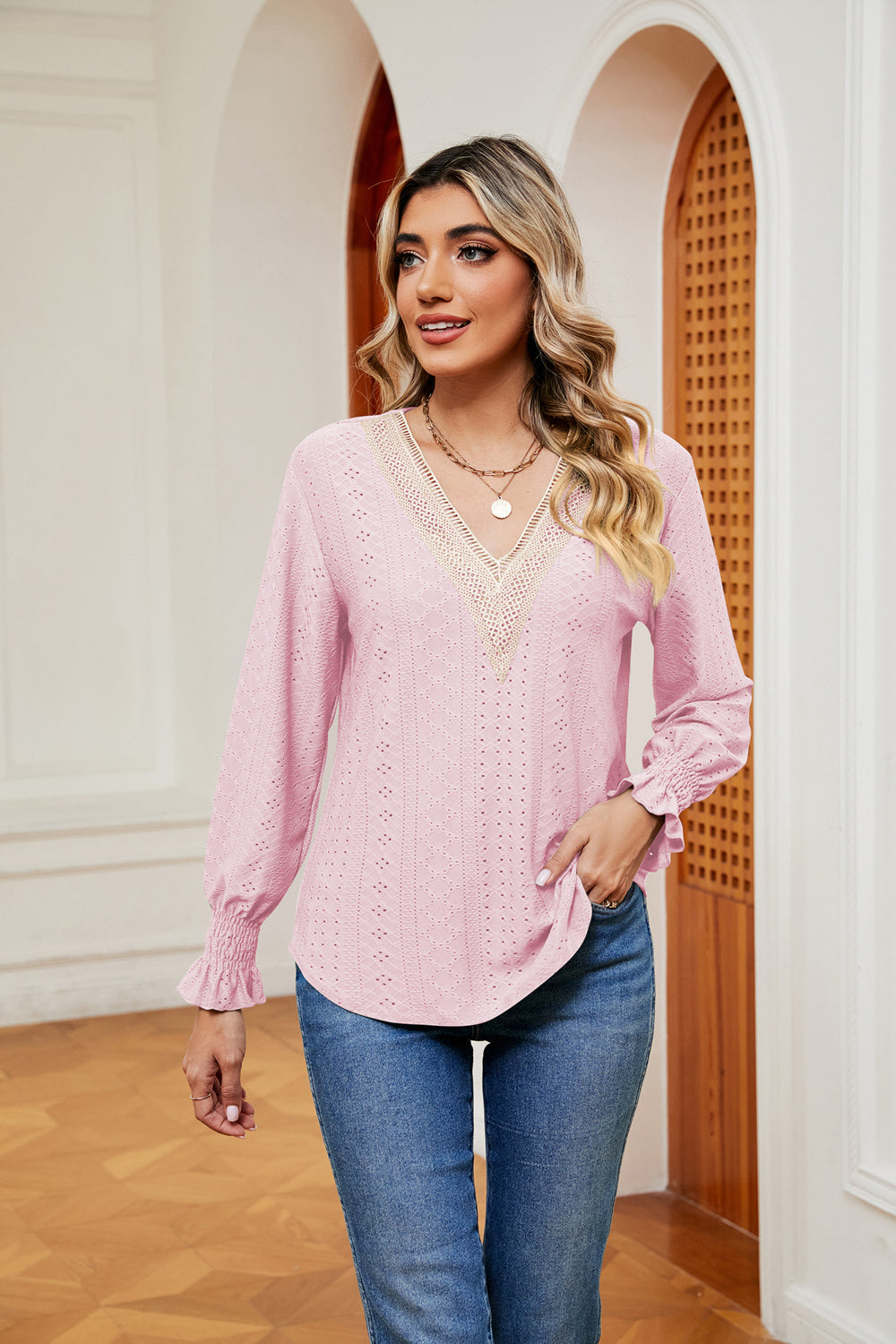 Model styling the blouse for brunch: feminine flounces meet modern flair.


