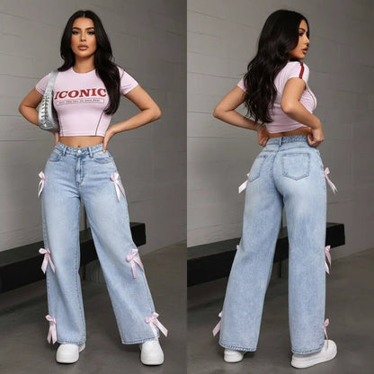 Model wearing bowknot collage washed women's jeans in urban setting with loose wide-leg vibe
