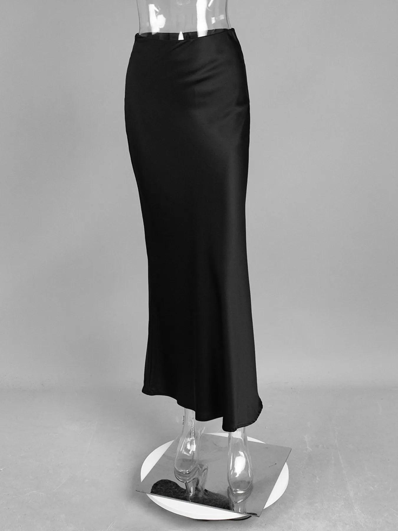 Monochrome look: black High-Waisted Maxi Skirt styled with a statement belt and boots.

