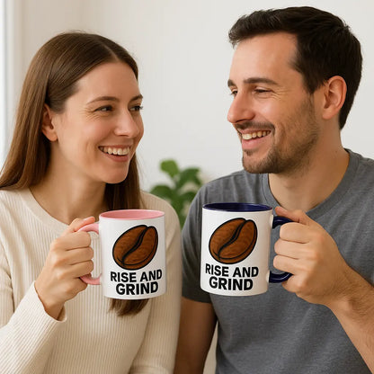 Motivational Rise and Grind coffee mug with bold black handle, placed on a wooden desk beside a laptop and notebook – perfect for energizing workdays.