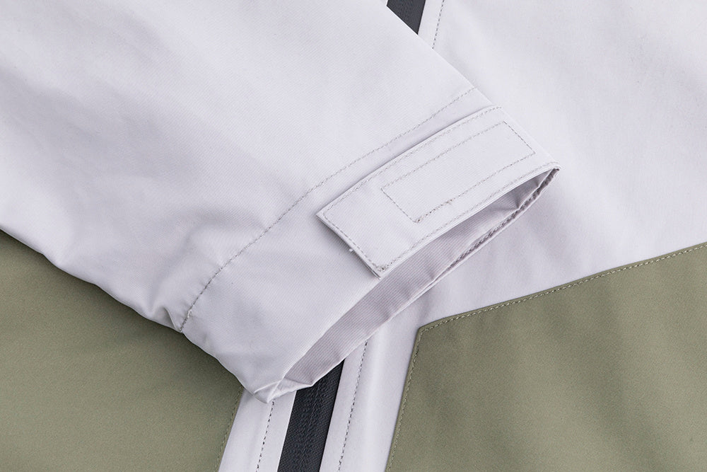 Mountaineering assault suit layered with harness and gear

