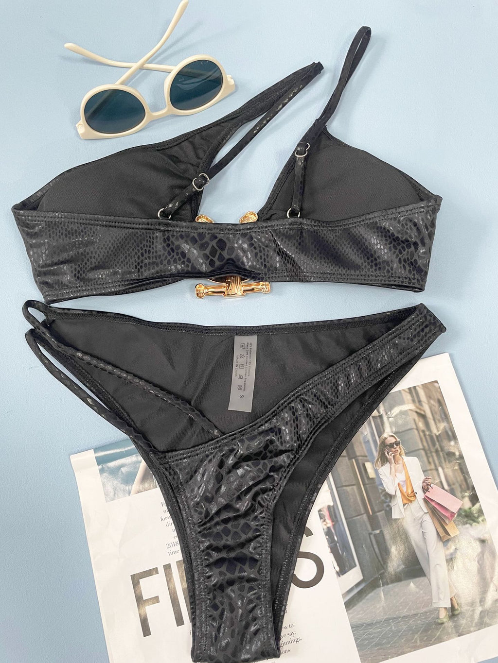 Navy blue snake print bikini – beach lifestyle shot