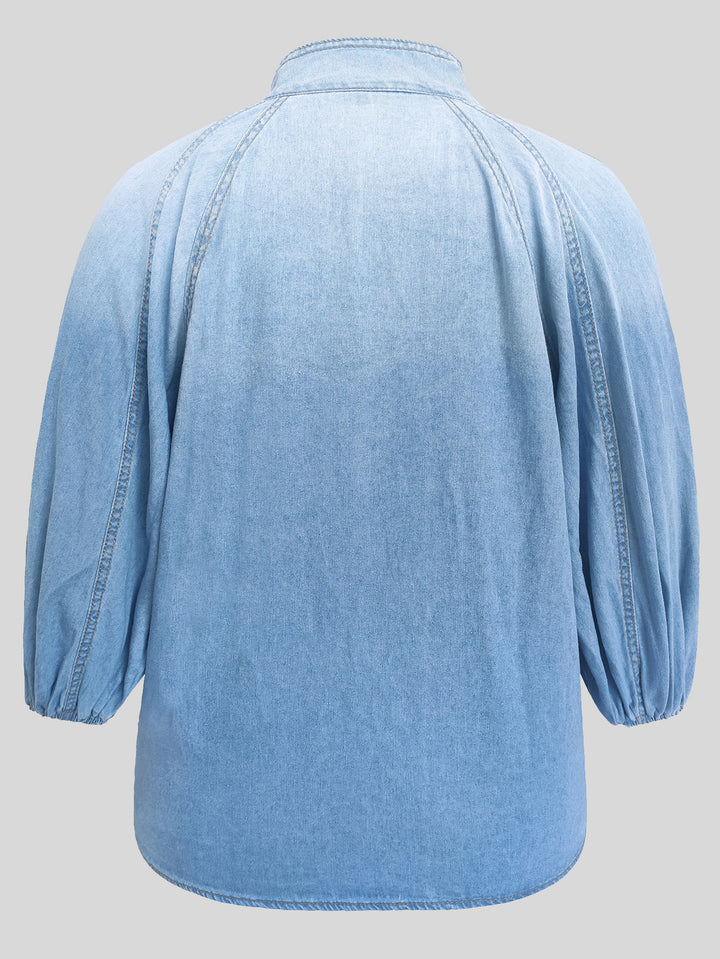 Light Blue 1481029 denim blouse rear profile, showing a stand collar, raglan seams, gathered sleeve cuffs and the curved hem.